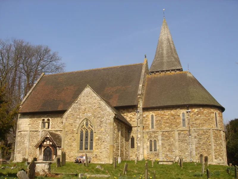 St Nicholas Church at Worth, Crawley, showing its rounded Saxon apse and shingled spire