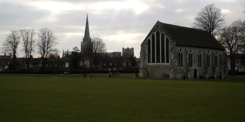 Priory Park, Chichester — Greyfriars Chapel on the green with the cathedral spire beyond
